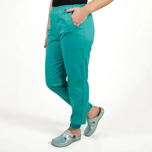 Costum Lotus 2, bluza asimetrica cu capse, pantaloni cu elastic in talie si manseta, turcoaz