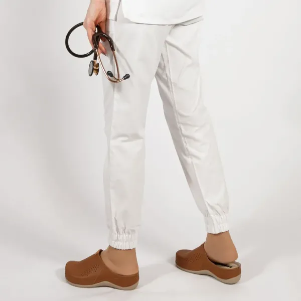 Costum Lotus 2, bluza asimetrica cu capse, pantaloni cu elastic in talie si manseta, alb